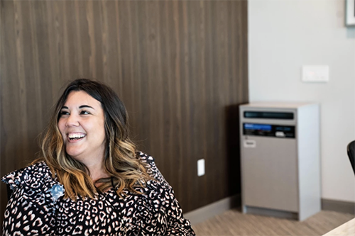 woman speaks with coworker